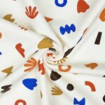 French Terry – leichter Kuschelsweat – Bunte Formen – Helles Natur