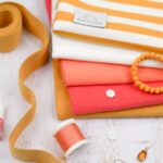 DIY Stoffmix - Garn - Label - Pomponborte - Knopf - Gummiband